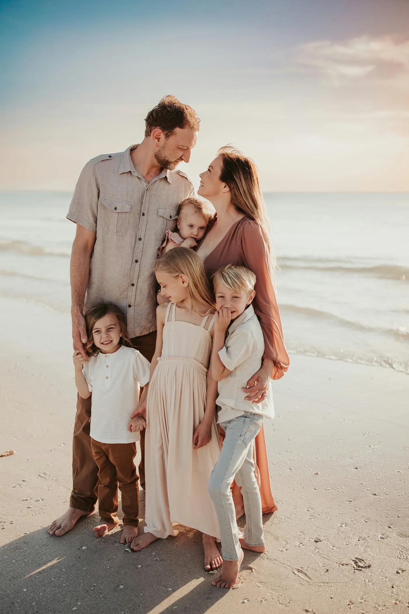 Family standing together on a beach